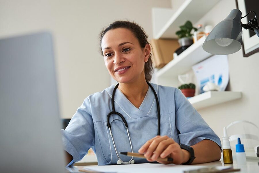 clinician using laptop